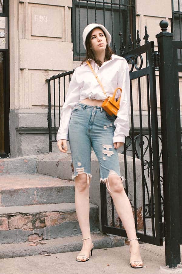 bucket hat outfit, how to style a bucket hat with bermuda shorts and a blouse