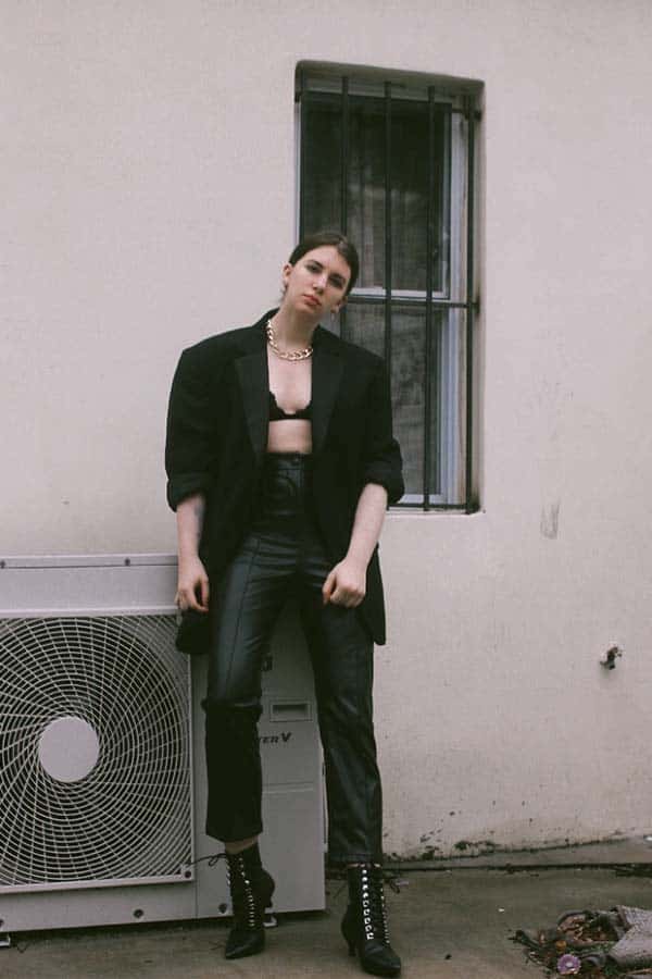 fall fashion trends 2020 lingerie details and lingerie as outerwear. Bra top with leather pants and oversized blazer on fashion blogger Gabrielle Arruda