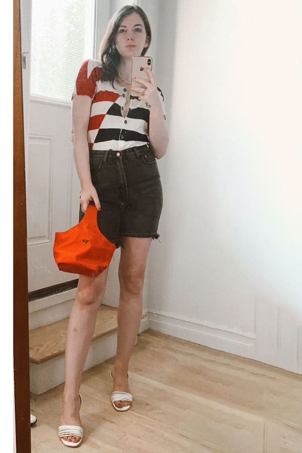 summer bbq outfit bermuda denim shorts with short sleeve cardigan, prada red nylon bag, and white square toe heels