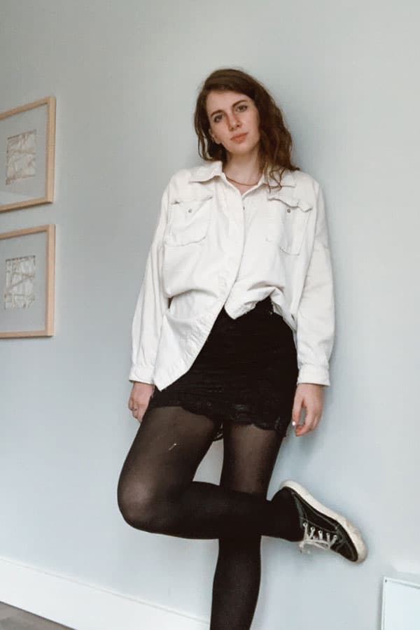 what to wear with black tights, black tights with mini skirt and shacket and classic sneakers
