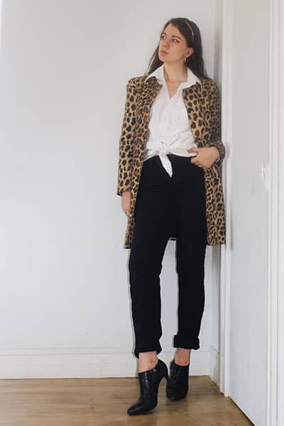the white mens button down on style blogger Gabrielle Arruda with a leopard coat and black straight leg jeans to display the french girl fashion style 