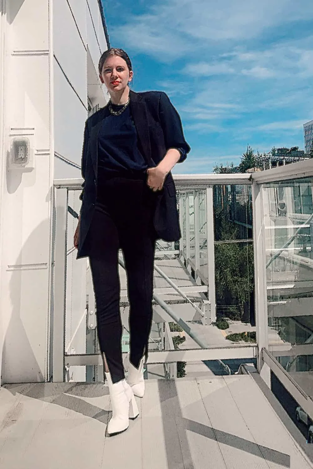 nyc fashion style, formula 1 blazer, split ankle leggings, heeled boots, and oversized tee on fashion blogger gabrielle arruda, types of fashion styles with pictures- NYC fashion style