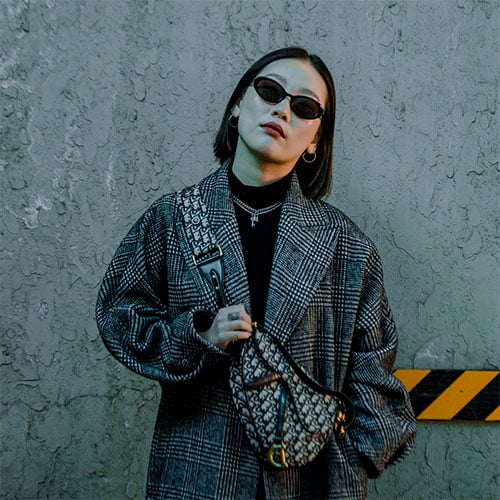 turtleneck outfit with plaid coat, black sunglasses and dior bag across body. different types of fashion styles with pictures, this one depicts "nyc style"