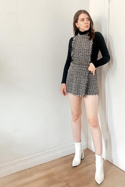 how to style a turtleneck under a mini dress or jumper, black turtleneck under a tweed mini dress with white heeled boots 