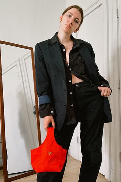 baggy jeans outfit idea women, with oversized blazer, prada nylon back and black shirt