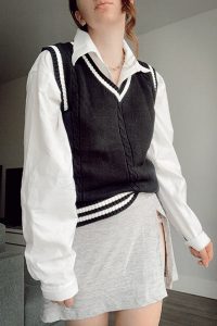 preppy sweater vest outfit with collared shirt and tennis skirt