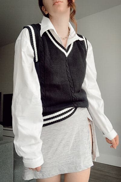 preppy sweater vest outfit with collared shirt and tennis skirt for the preppy fashion style 