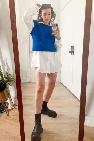 style blogger gabrielle arruda wearing men's oversized shirt with sweater vest, summer fashion trend: dad shirts