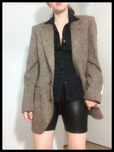 fitted blouse with bike shorts and oversized blazer