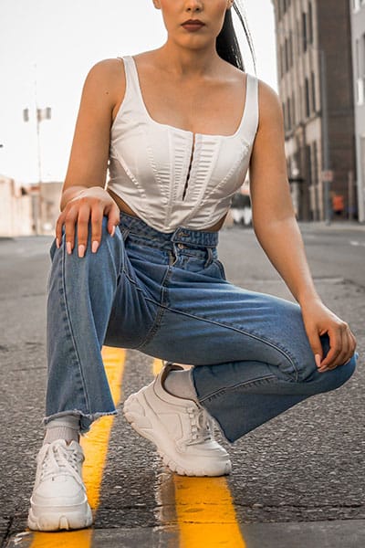 winter fashion trends 2020/2021 aughts fashion- corset top with baggy jeans and sneakers