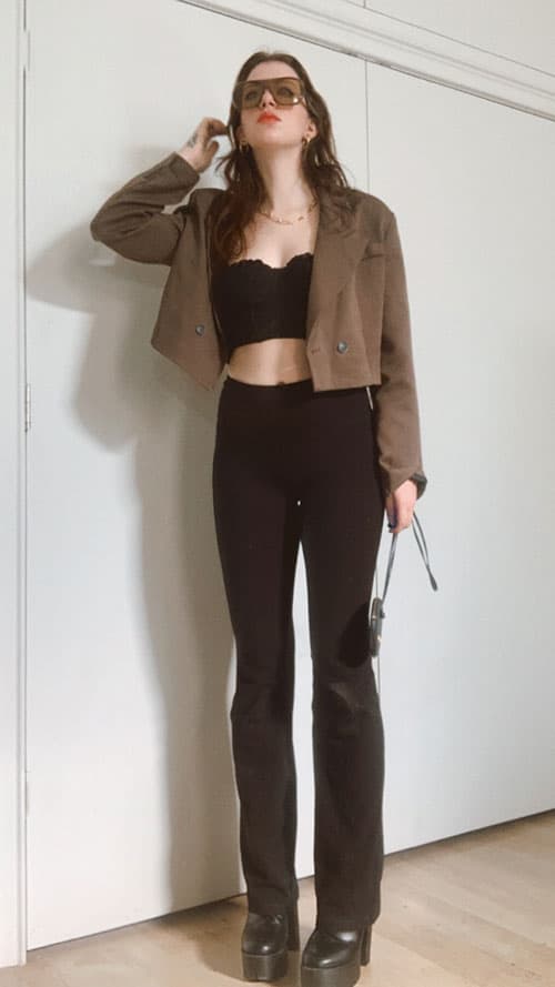 black flared leggings outfit idea for a date, platform boots, cropped corset and cropped boxy blazer with aviator 70's celine sunglasses