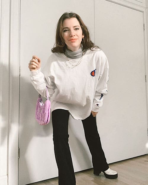 black flare leggings outfits with white platform boots and oversized long sleeve shirt and nylon 90's style bag