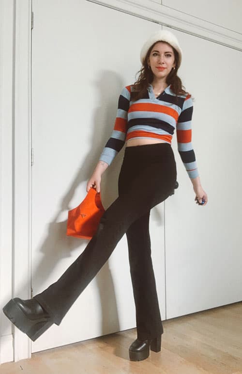 flare leggings outfits with bucket hat and fitted striped polo and prada nylon bag on gabrielle arruda