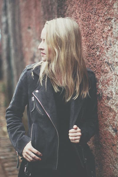 types of fashion styles: biker style. girl in leather moto jacket and black tee