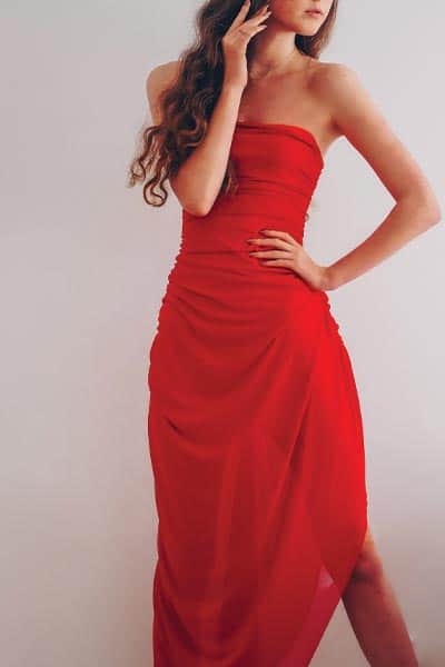 formal fashion style, woman in strapless formal red gown 