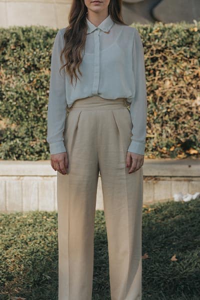 light academia fashion style, girl in white blouse and tan wide leg trouser