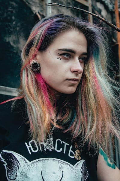 funk fashion style picture, girl with edgy t-shirt, gauge earrings, and colored hair