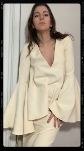 spring fashion trends 2021 bell sleeves. gabrielle arruda style blogger in ellery dress with large bell sleeves