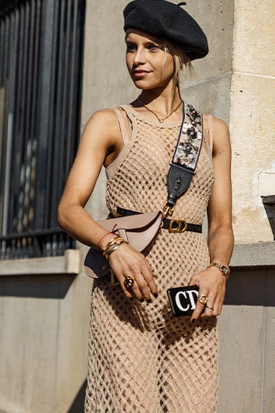 different types of fashion styles, the fashionista. influencer Cara Daour wearing dior bag and mesh raf dress with beret, trendy outfit 