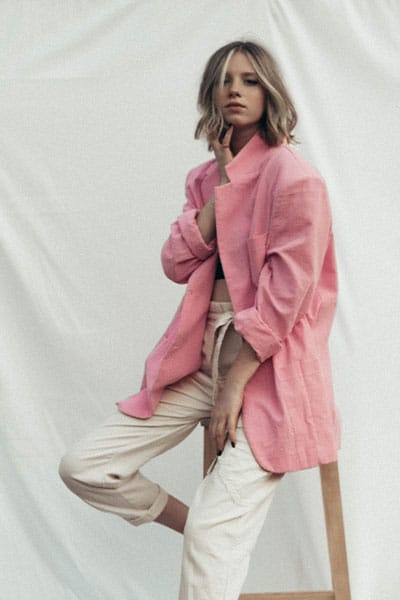 spring fashion trends 2021, girl in pastel pink blazer and white trousers