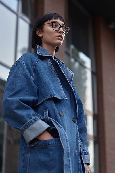double denim outfit with denim trench coat