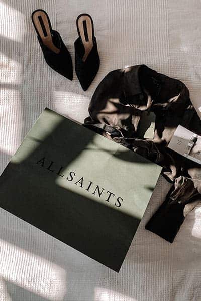 all saints shopping bag with coat and heels, don't impulse buy if you want style on a budget 
