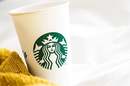 rules for cleaning out closet, know when to start- image of sweater next to starbucks coffee cup