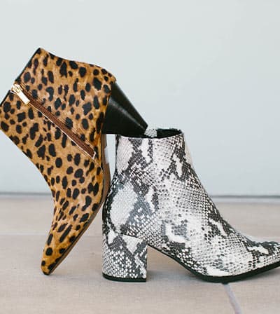 one pair of snakeskin boots, one shoe of leopard print boot, fashion mistake: bad print mixing