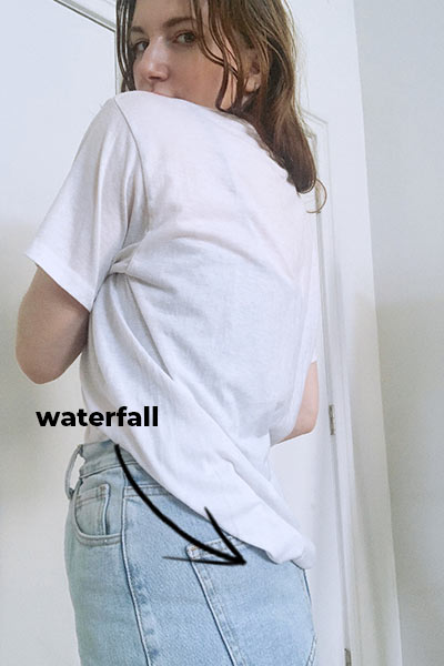 how to do a french tuck, example of waterfall line the french tuck should have as it falls from tucked into the front, to loose in the back