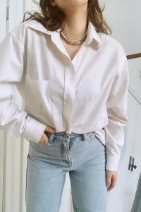 example of french tuck, blouse half-tucked into jeans
