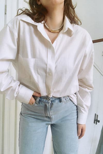 example of french tuck, blouse half-tucked into jeans