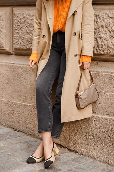 french tuck with a sweater, jeans, trench, and chanel heels