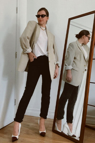 style blogger gabrielle arruda in a rosie huntington-whiteley style outfit. tan blazer with black jeans, white tee and pointy heels