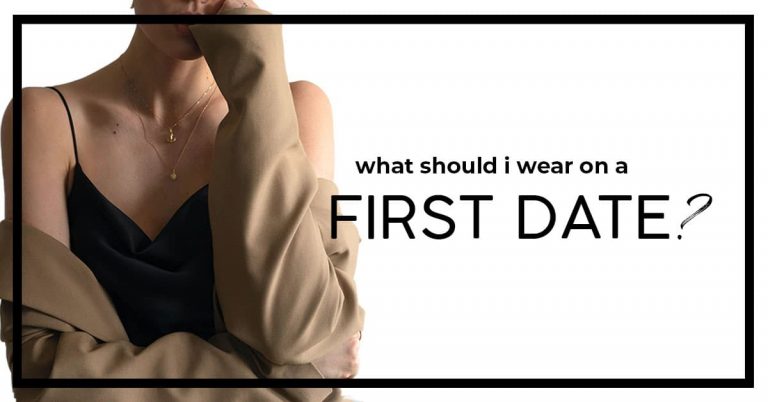 what should i wear on a first date with image of woman in black camisole and trench and thin gold necklace