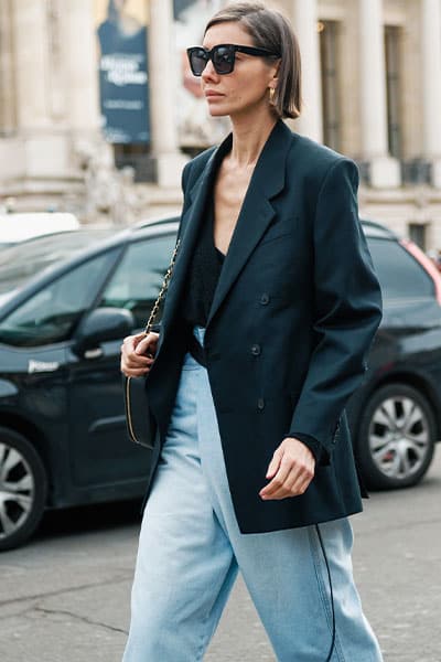 vogue editor wearing black capsule wardrobe basic blazer with jeans and bodysuit