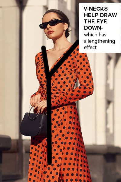 woman wearing a wrap dress with v-neck. v-necklines help draw the eye down- which has a lengthening effect and helps you appear taller 