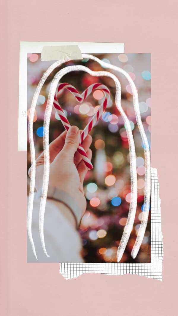 cute pink christmas holiday wallpaper for iphone. pink background with scrap of grid paper and scrap of white paper behind image of two candy canes in heart shape- with some doodles over it 