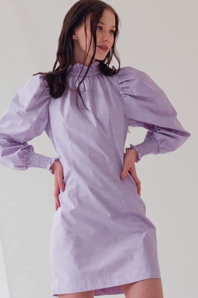 woman wearing purple puff sleeve dress with loosely defined waist for rectangle body type outfit 