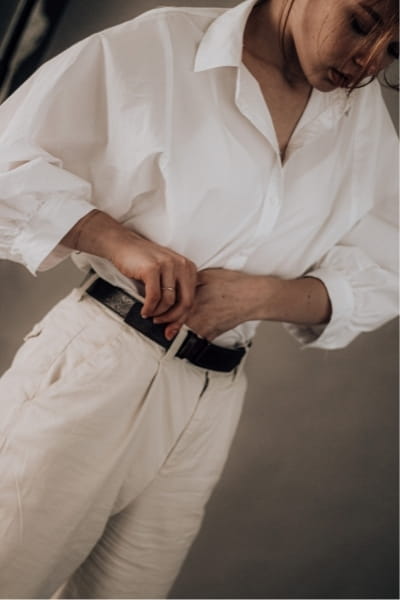 loose white shirt tucked into straight leg trousers with black belt, rectangle body outfit idea