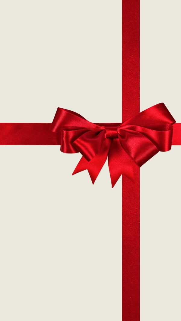 off white background with red ribbon in gift bow to look like a present. holiday wallpaper for iphone