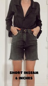 gabrielle arruda wearing 6 inch inseam shorts, view from front, hem hits about mid-thigh