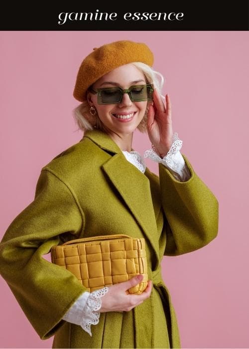 woman with beret and colorful glasses and frilly blouse with colorful coat to show gamine style essence