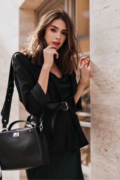 woman wearing belted blazer and slip dress showing timeless classic outfit 