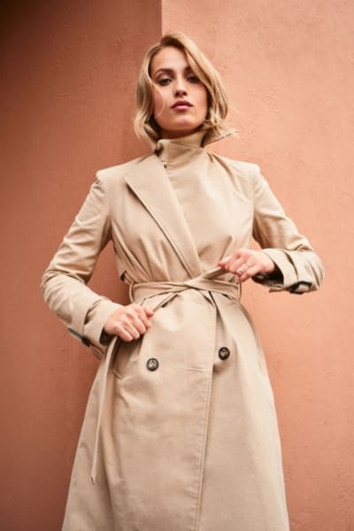 woman in tan classic trench coat 