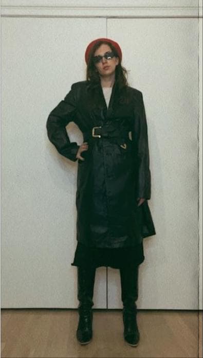 gabrielle arruda wearing long leather trench for fall capsule wardrobe 2022